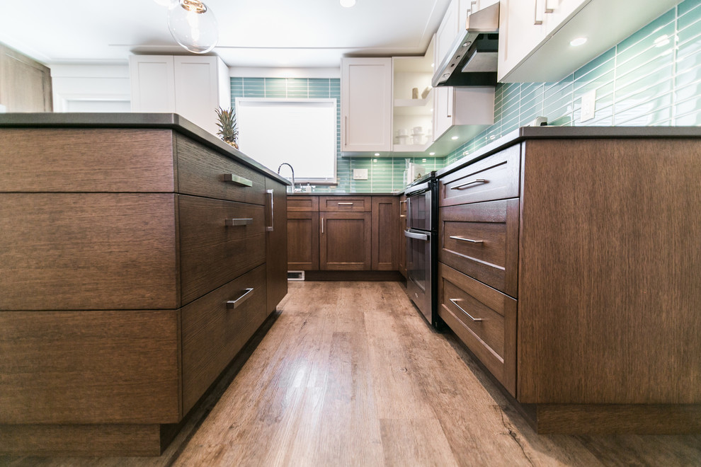 Enclosed kitchen - mid-sized transitional u-shaped dark wood floor and brown floor enclosed kitchen idea in Vancouver with flat-panel cabinets, dark wood cabinets, glass tile backsplash, a double-bowl sink, blue backsplash, stainless steel appliances and an island