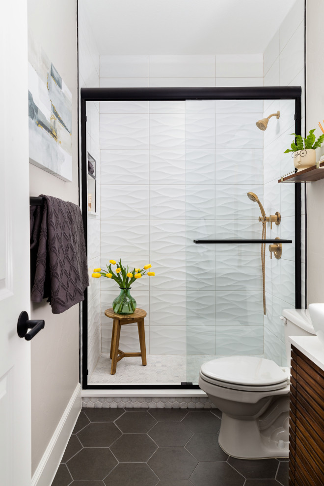 This is an example of a mid-sized contemporary bathroom in Dallas with an alcove shower, a two-piece toilet, white tile, porcelain tile, grey walls, porcelain floors, engineered quartz benchtops, a sliding shower screen, white benchtops, a niche, black floor and dark wood cabinets.