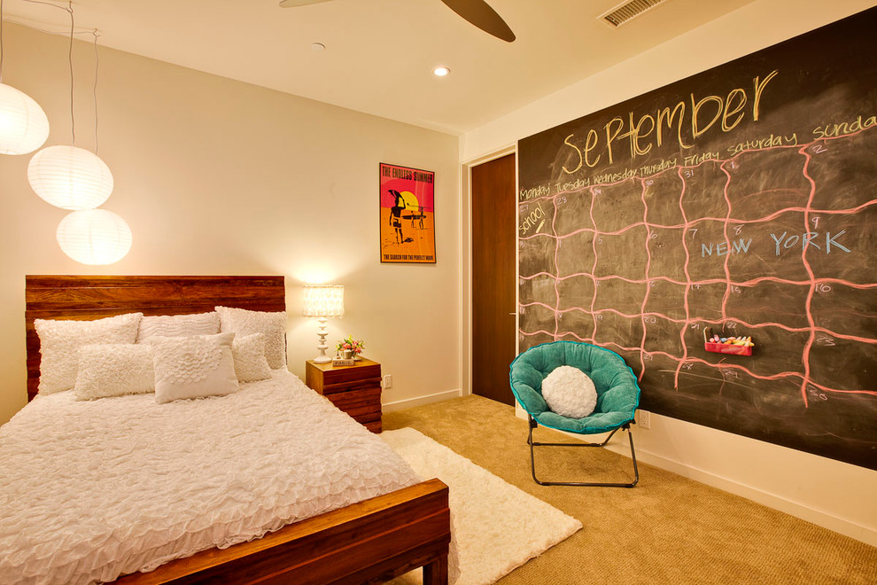 This is an example of a contemporary kids' room in Los Angeles with white walls.