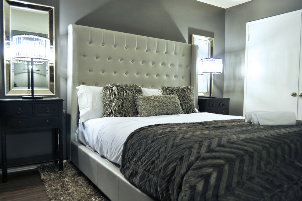 Inspiration for a mid-sized transitional master bedroom in Los Angeles with grey walls and dark hardwood floors.