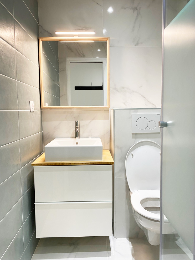 Inspiration for a small scandinavian 3/4 bathroom in Paris with white cabinets, a corner shower, a wall-mount toilet, green tile, a drop-in sink, wood benchtops, a hinged shower door, a single vanity and a floating vanity.
