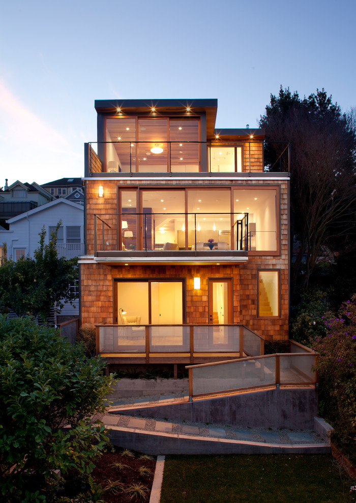 Inspiration for a mid-sized contemporary three-storey brown exterior in San Francisco with mixed siding and a flat roof.
