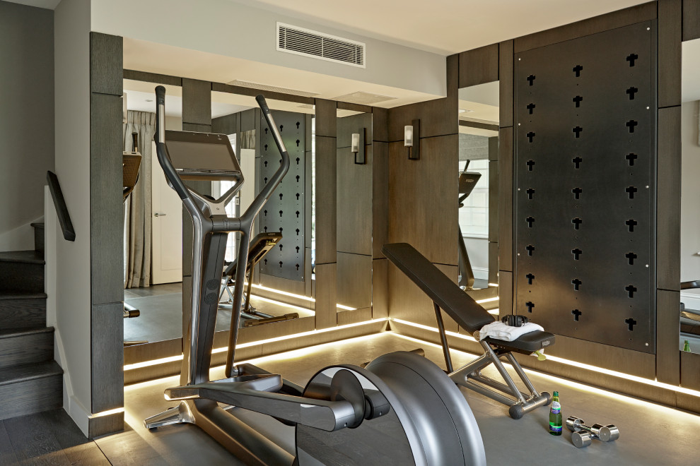 This is an example of a contemporary multipurpose gym in London with grey walls and grey floor.