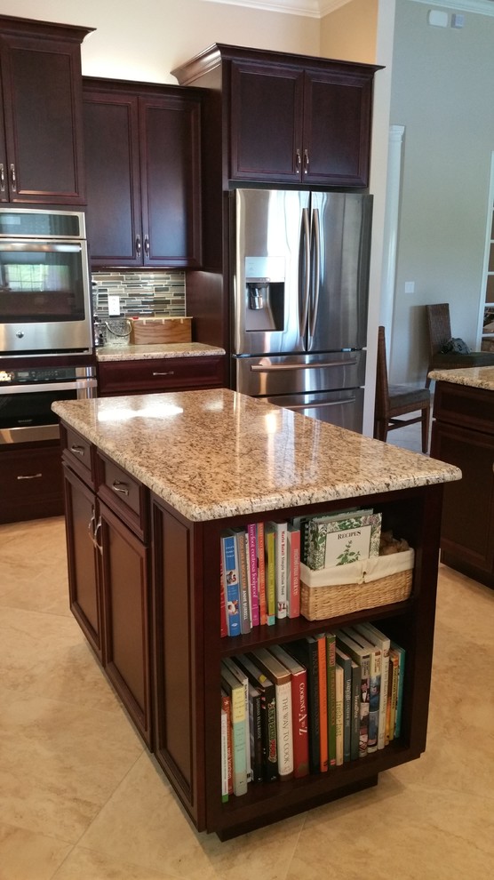 Example of a large transitional beige floor kitchen design in Orange County with dark wood cabinets, granite countertops, multicolored backsplash, matchstick tile backsplash, stainless steel appliances, two islands, an undermount sink and shaker cabinets