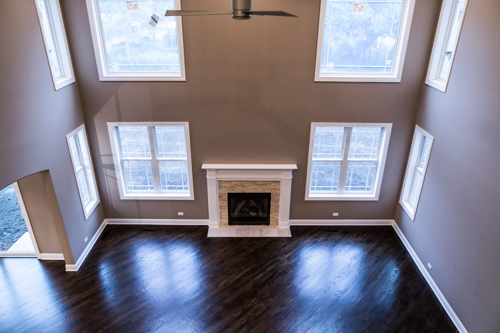 Inspiration for a huge transitional formal and open concept dark wood floor home design remodel in Chicago with brown walls, a standard fireplace, a stone fireplace and no tv