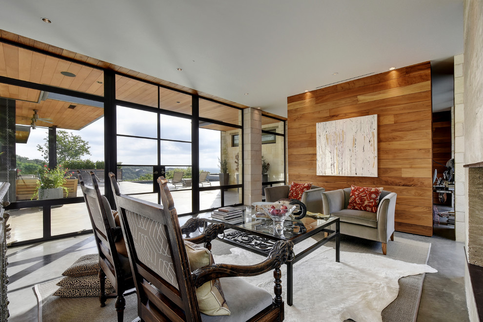 Inspiration for a contemporary formal and enclosed concrete floor living room remodel in Austin with beige walls