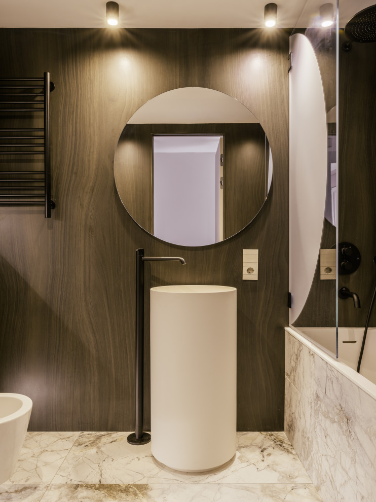 This is an example of a mid-sized contemporary master bathroom in Moscow with white walls, marble floors, grey floor, shaker cabinets, dark wood cabinets, an undermount tub, a bidet, brown tile, wood-look tile, a pedestal sink, solid surface benchtops, an open shower, white benchtops, a single vanity, a freestanding vanity and panelled walls.