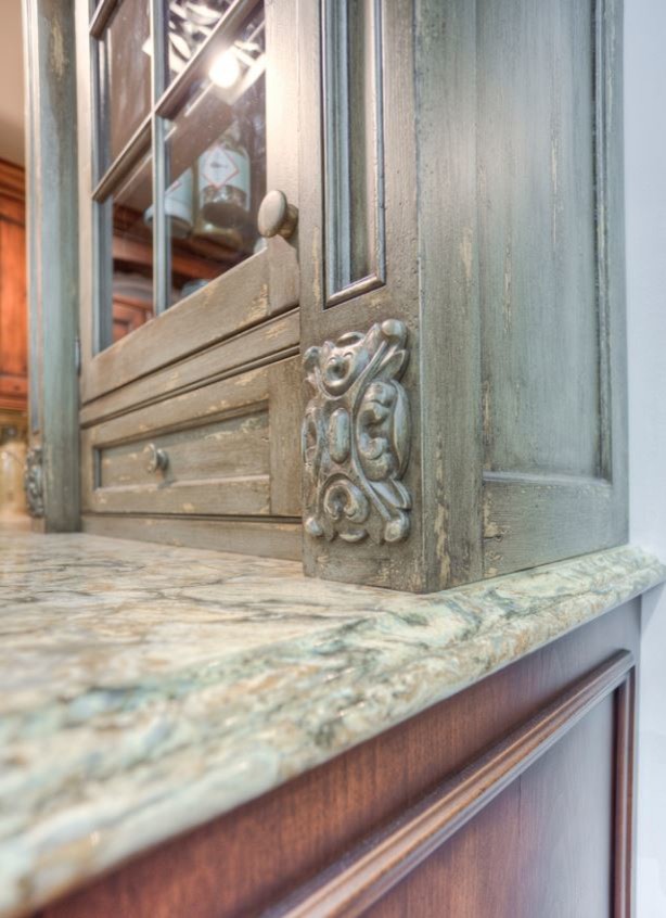 Eat-in kitchen - large rustic u-shaped porcelain tile eat-in kitchen idea in Toronto with an undermount sink, raised-panel cabinets, brown cabinets, quartz countertops, beige backsplash, stainless steel appliances and an island