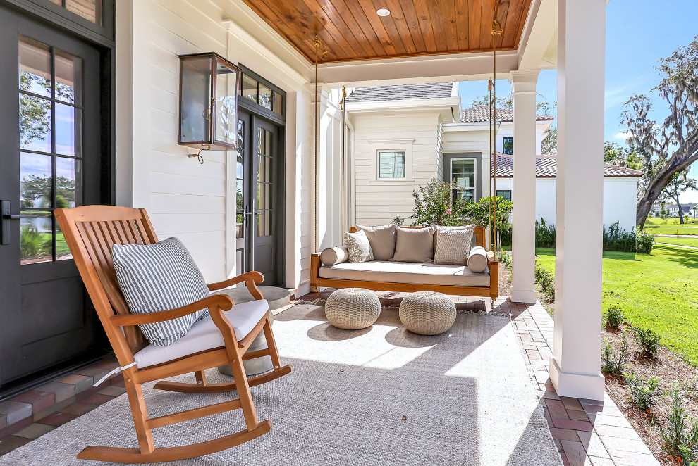 This is an example of a transitional porch design in Orlando.
