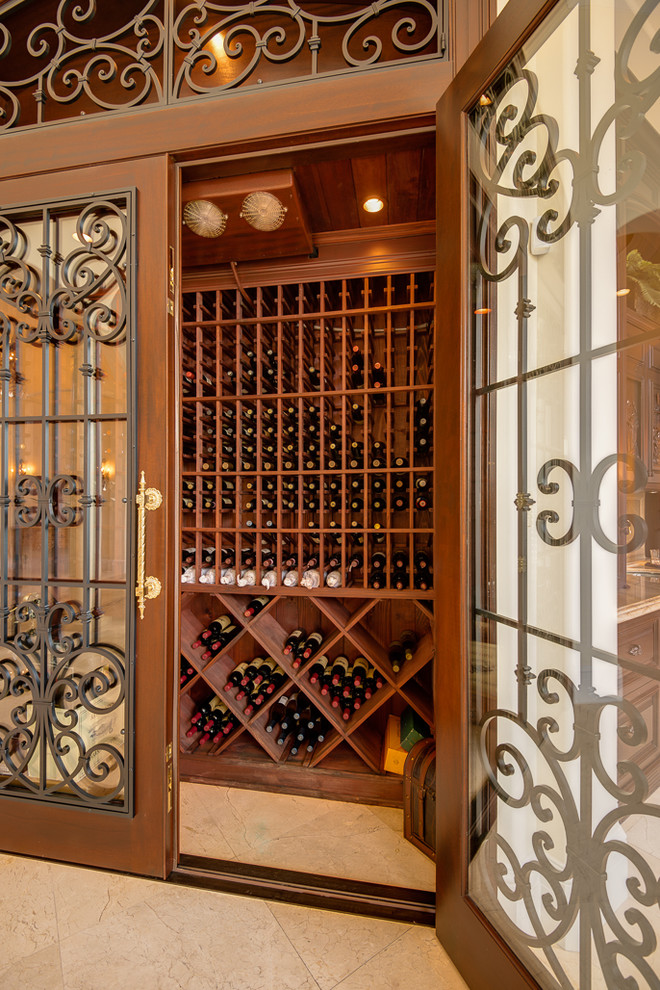 Photo of a traditional wine cellar in Miami with storage racks.