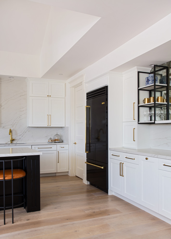 Kitchen - large transitional kitchen idea in Orange County with black appliances