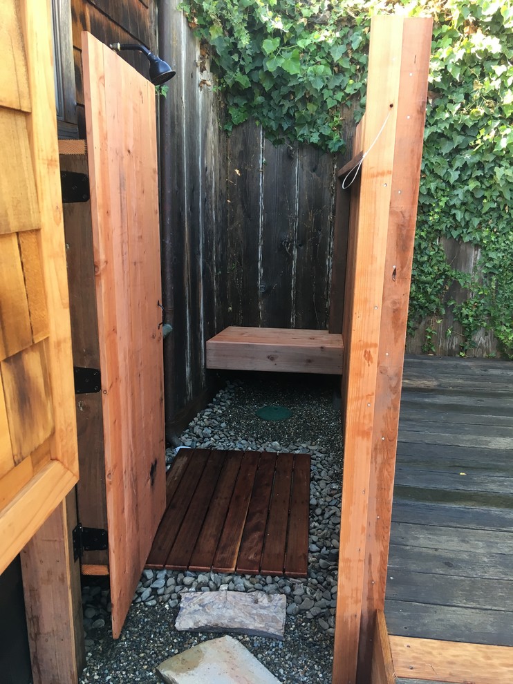 Inspiration for a mid-sized beach style backyard patio in Other with an outdoor shower.