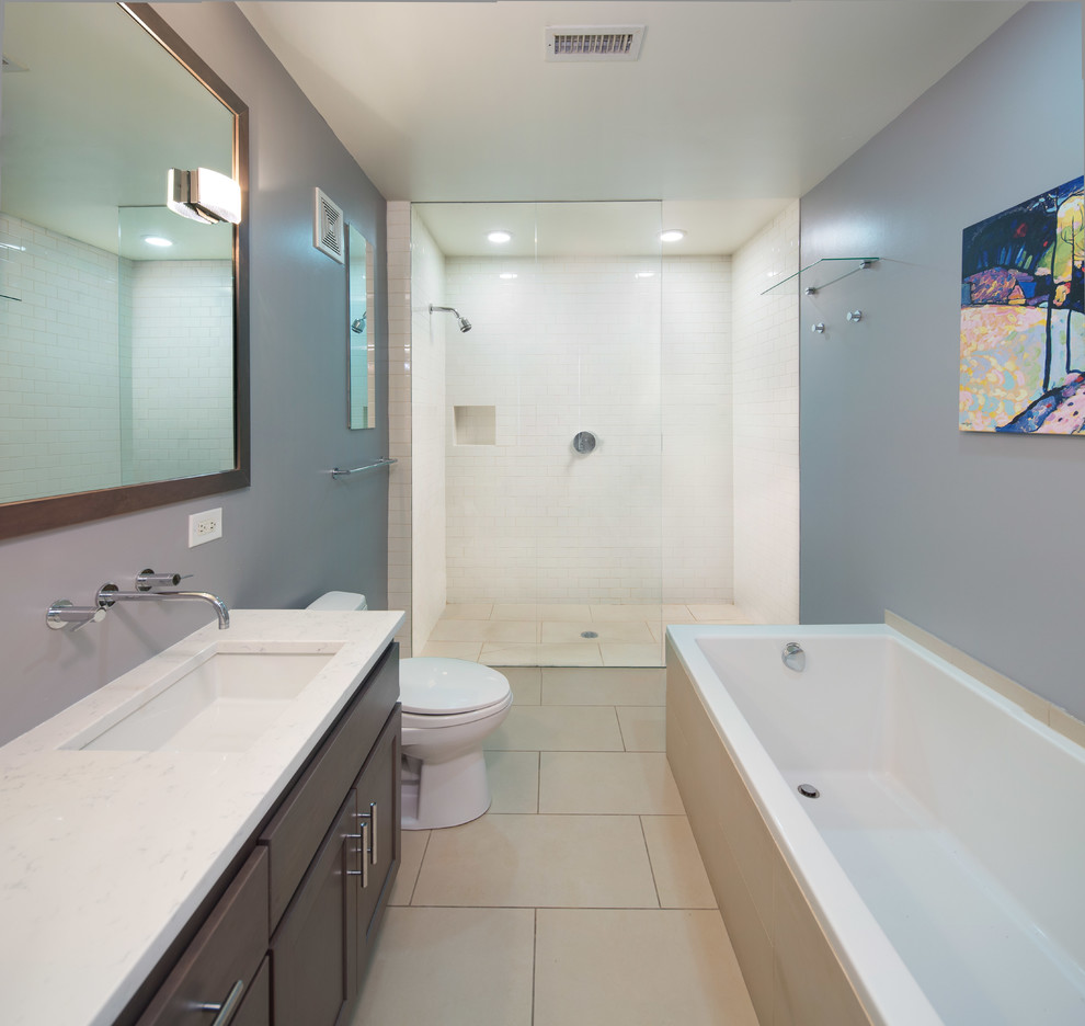 Large modern master bathroom in Chicago with dark wood cabinets, a drop-in tub, an alcove shower, a two-piece toilet, grey walls, an undermount sink, shaker cabinets, granite benchtops, white tile, ceramic floors and subway tile.