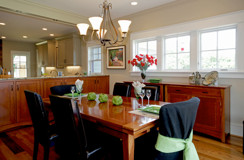 Photo of a mid-sized transitional kitchen/dining combo in Richmond with grey walls and medium hardwood floors.