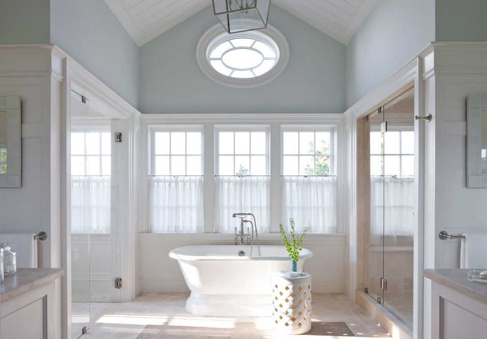 This is an example of a beach style bathroom in Boston with a freestanding tub.