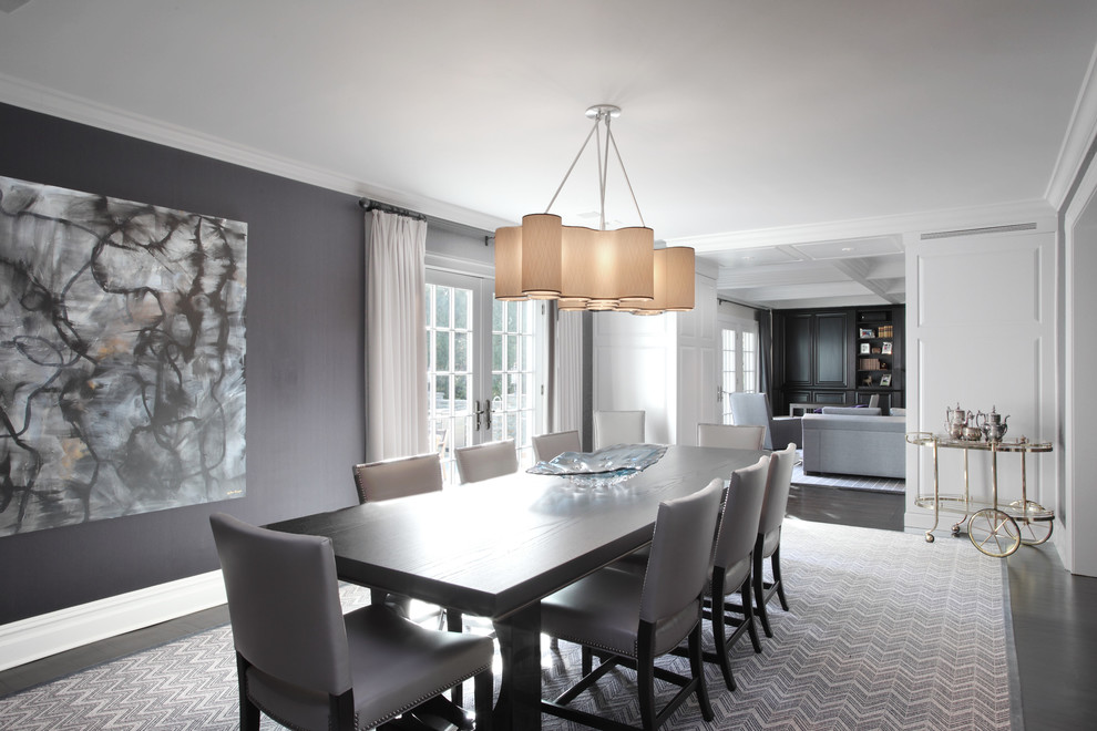 Photo of a large contemporary separate dining room in New York with grey walls, dark hardwood floors and no fireplace.