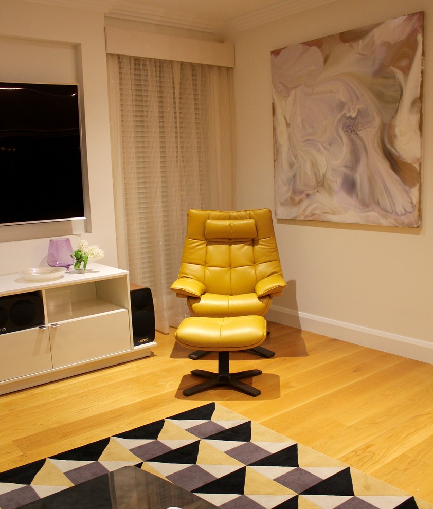 Design ideas for a contemporary open concept living room in Sydney with light hardwood floors and a wall-mounted tv.