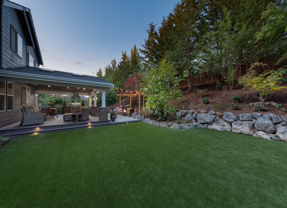 This is an example of a large transitional backyard garden in Seattle.