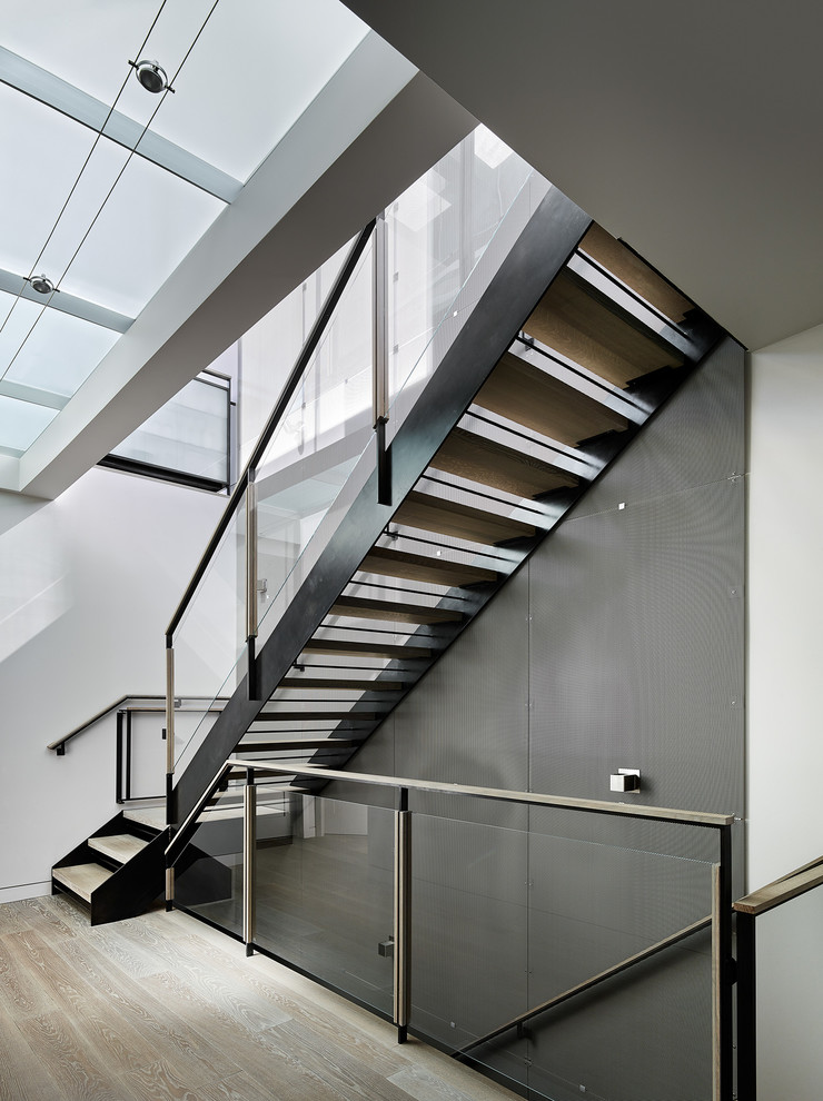 This is an example of a contemporary wood staircase in San Francisco with open risers.