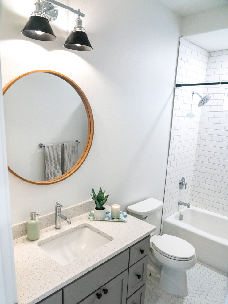 Inspiration for a traditional bathroom in Other with shaker cabinets, grey cabinets, an alcove bath, a shower/bath combination, white tiles, ceramic tiles, white walls, ceramic flooring, engineered stone worktops, white floors, white worktops, a single sink and a built in vanity unit.