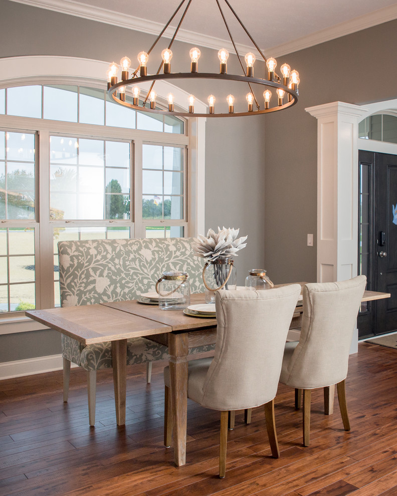 Inspiration for a contemporary dining room in Cleveland with grey walls and medium hardwood floors.
