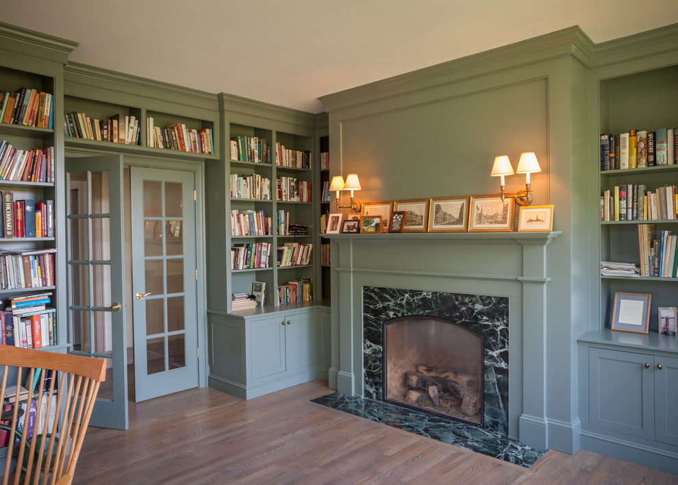 Photo of a large traditional study room in Boston with green walls and dark hardwood floors.