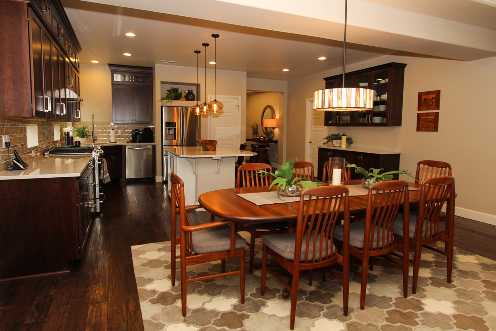 Inspiration for a large transitional dark wood floor great room remodel in Denver with beige walls