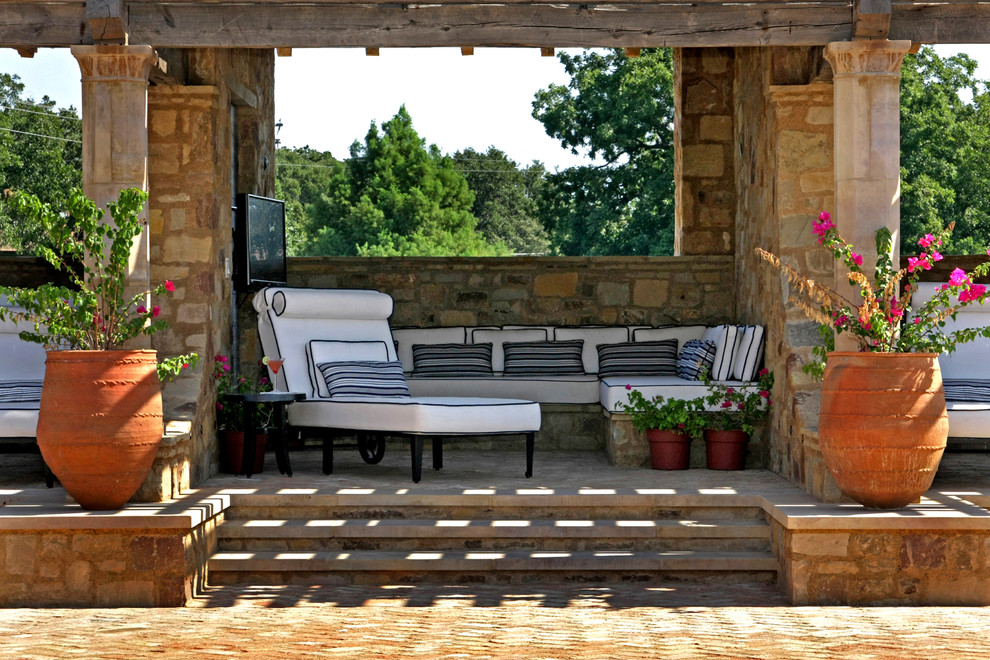This is an example of a mediterranean patio in Austin with a gazebo/cabana.