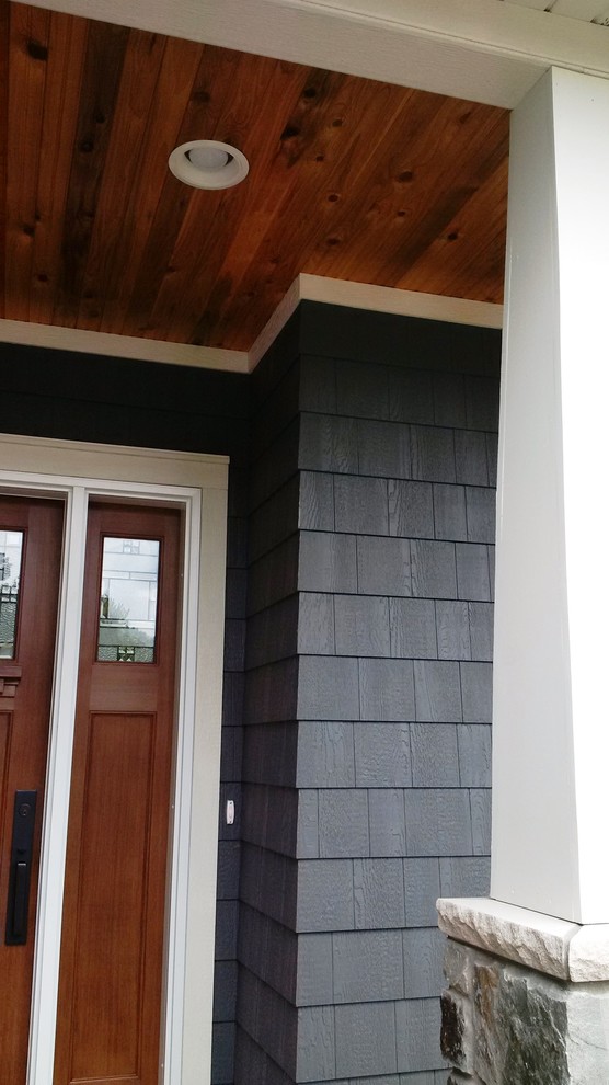 Example of a mountain style front door design with blue walls