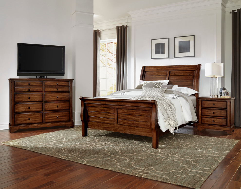 Photo of a mid-sized traditional bedroom in Other with medium hardwood floors and white walls.