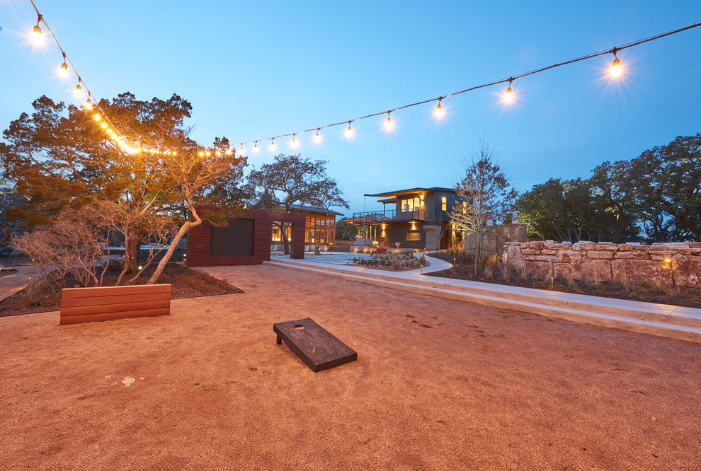 Design ideas for an expansive modern one-storey exterior in Austin with a shed roof and a metal roof.