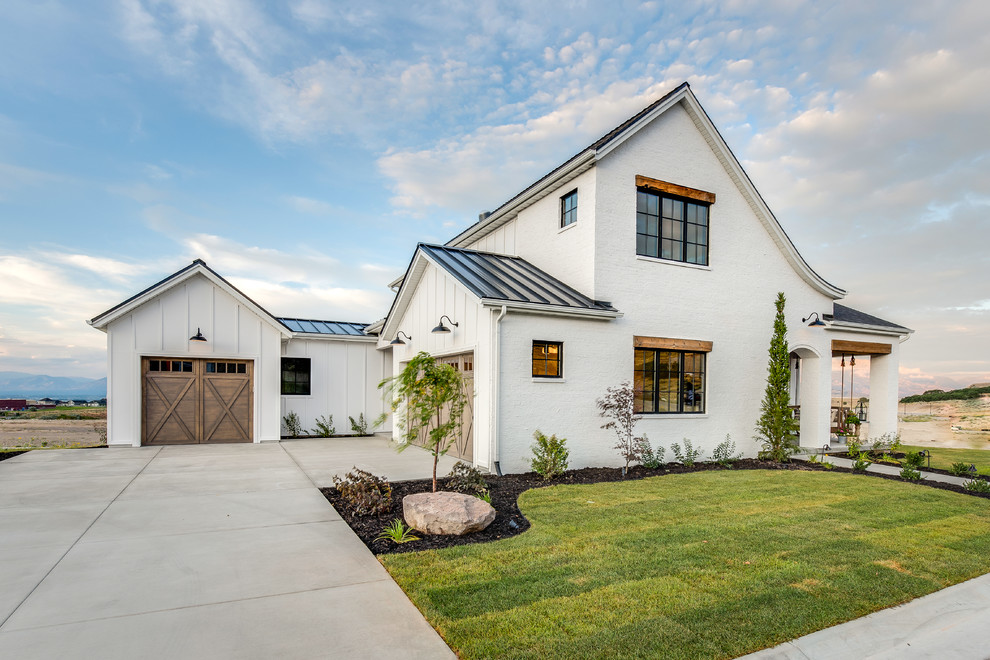 Country white two-story mixed siding gable roof photo in Salt Lake City with a metal roof