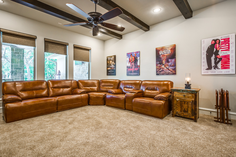 This is an example of a large transitional open concept home theatre in Dallas with grey walls, carpet and a wall-mounted tv.