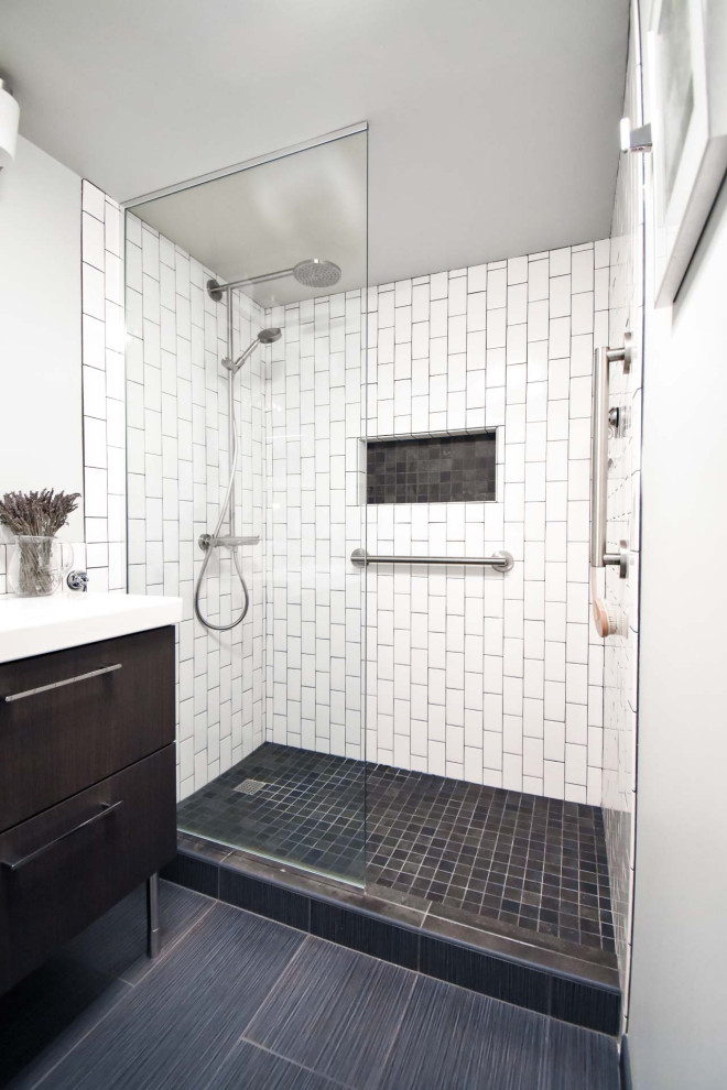 Photo of a small modern 3/4 bathroom in Portland with flat-panel cabinets, brown cabinets, an alcove shower, a two-piece toilet, white tile, subway tile, grey walls, ceramic floors, an integrated sink, black floor, an open shower, white benchtops, a niche, a single vanity and a freestanding vanity.