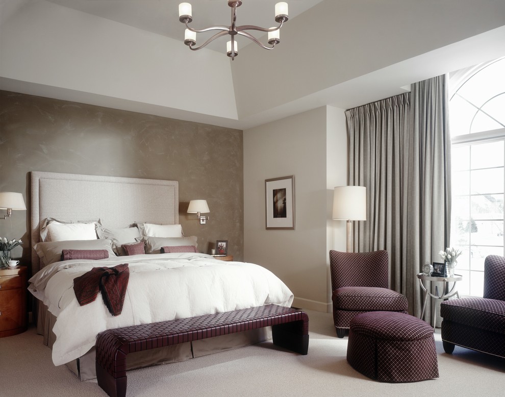 This is an example of a transitional bedroom in Detroit with grey walls and carpet.