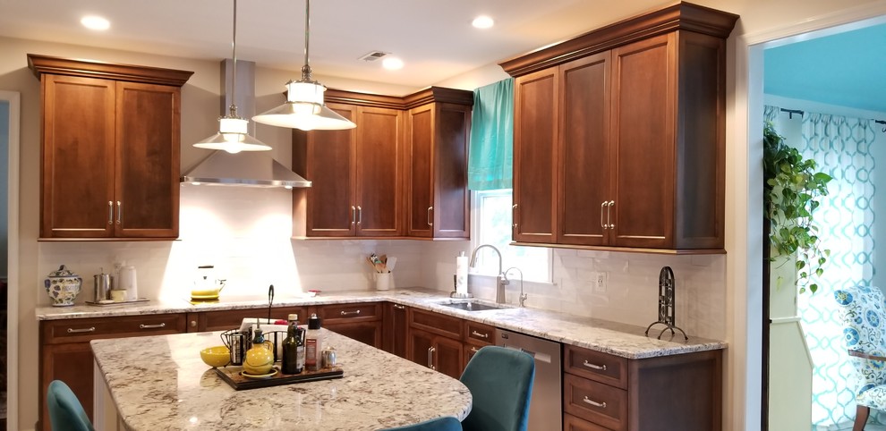 Inspiration for a mid-sized transitional l-shaped separate kitchen in Philadelphia with an undermount sink, recessed-panel cabinets, medium wood cabinets, granite benchtops, white splashback, subway tile splashback, stainless steel appliances, porcelain floors, with island, beige floor and multi-coloured benchtop.