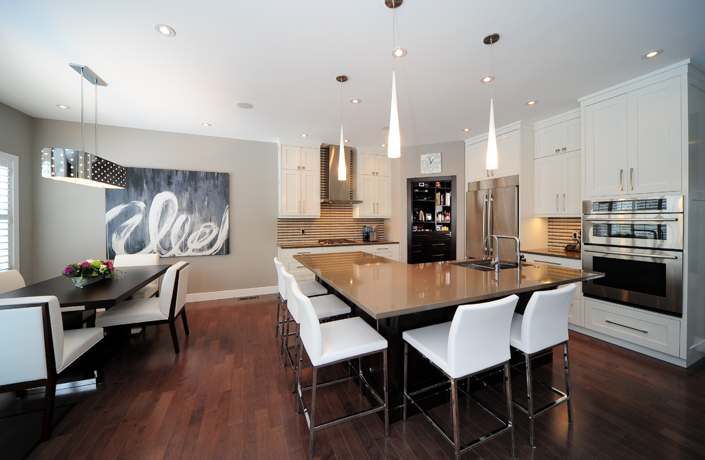 Photo of a contemporary eat-in kitchen in Calgary with stainless steel appliances.