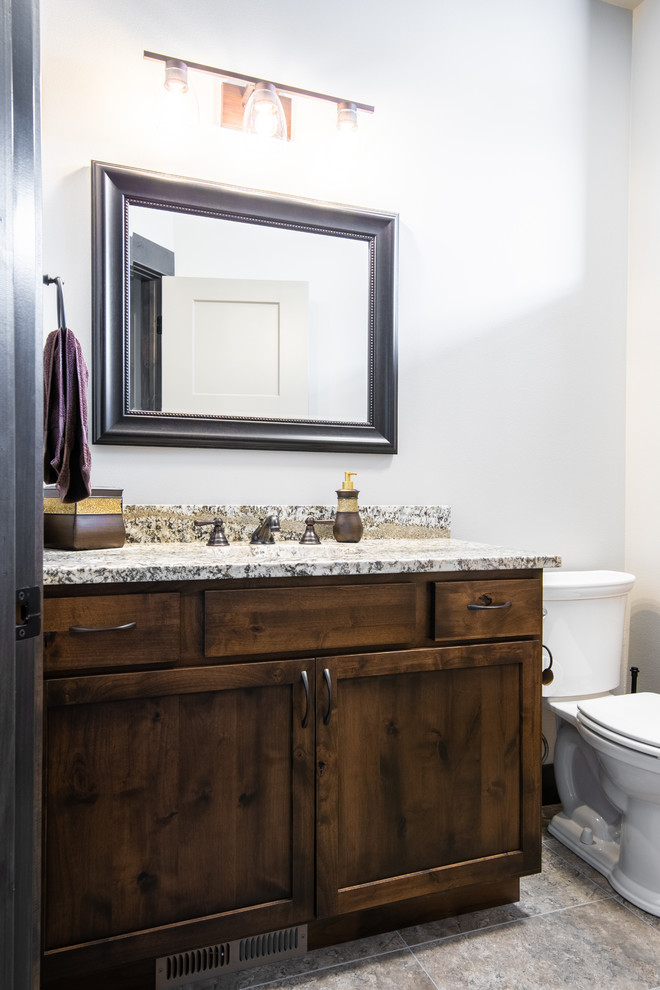 Mid-sized transitional medium tone wood floor and brown floor bathroom photo with shaker cabinets and medium tone wood cabinets
