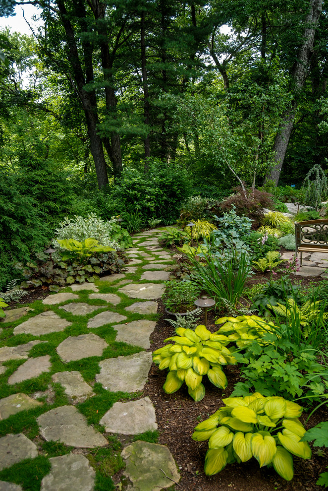 Traditional shaded garden in Boston with natural stone pavers.