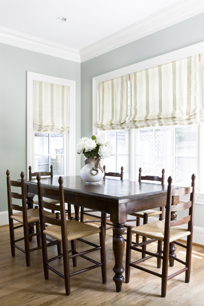 Traditional dining room in DC Metro with grey walls and medium hardwood floors.