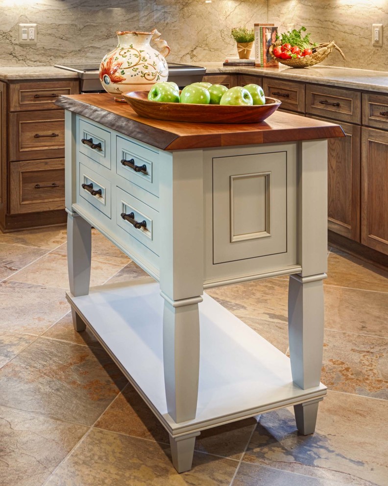 Example of an u-shaped porcelain tile kitchen design in DC Metro with quartzite countertops and an island