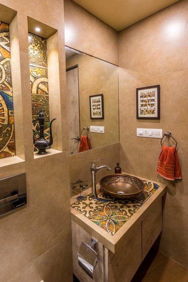 This is an example of a small mediterranean powder room in Mumbai.
