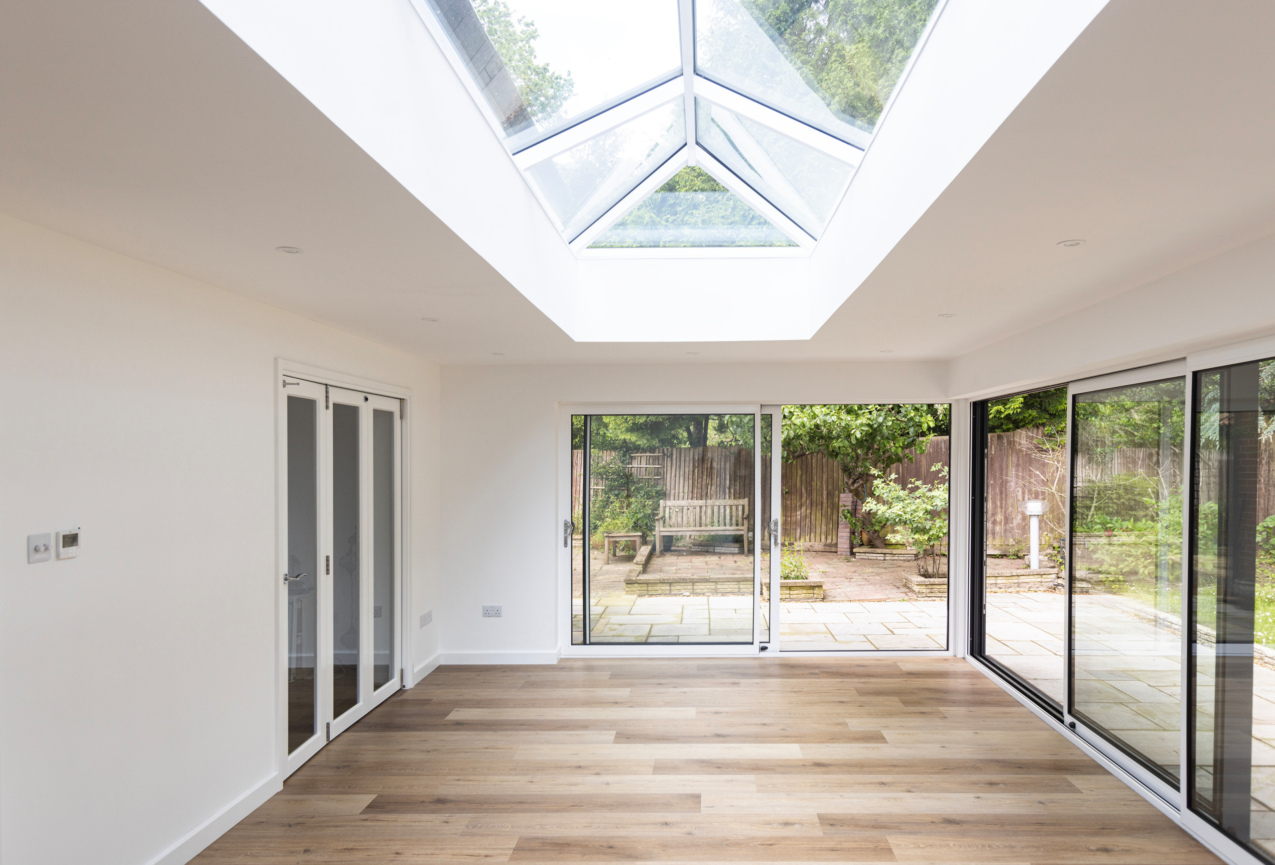 View of living space, roof lantern and sliding doors