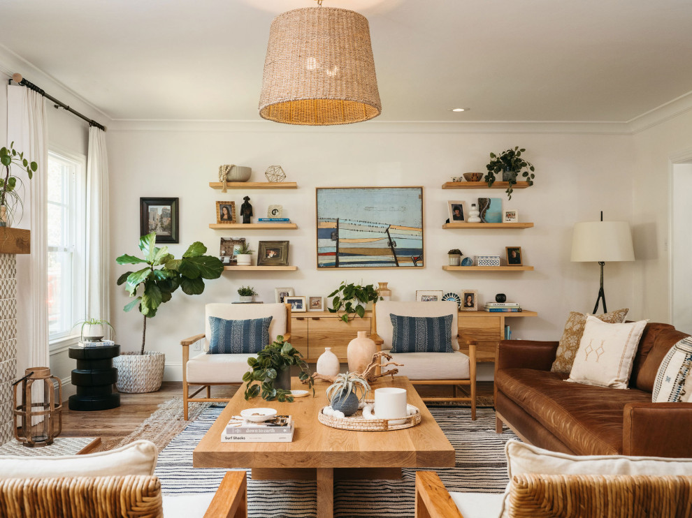 Living room - coastal enclosed medium tone wood floor and brown floor living room idea in San Francisco with white walls