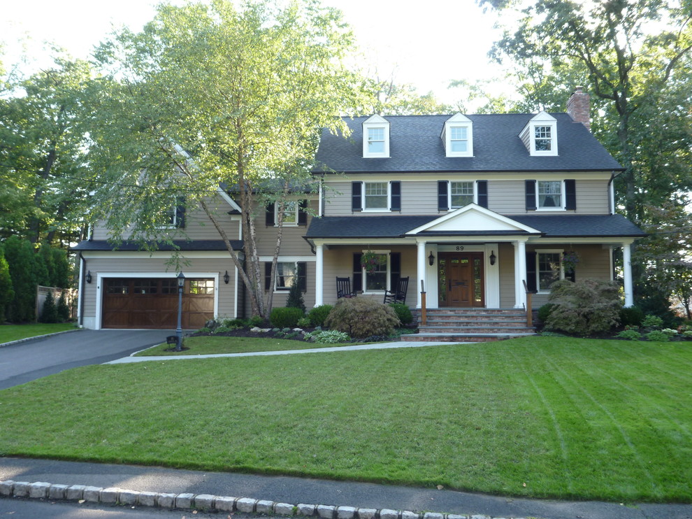 Inspiration for a mid-sized timeless brown two-story vinyl gable roof remodel in New York