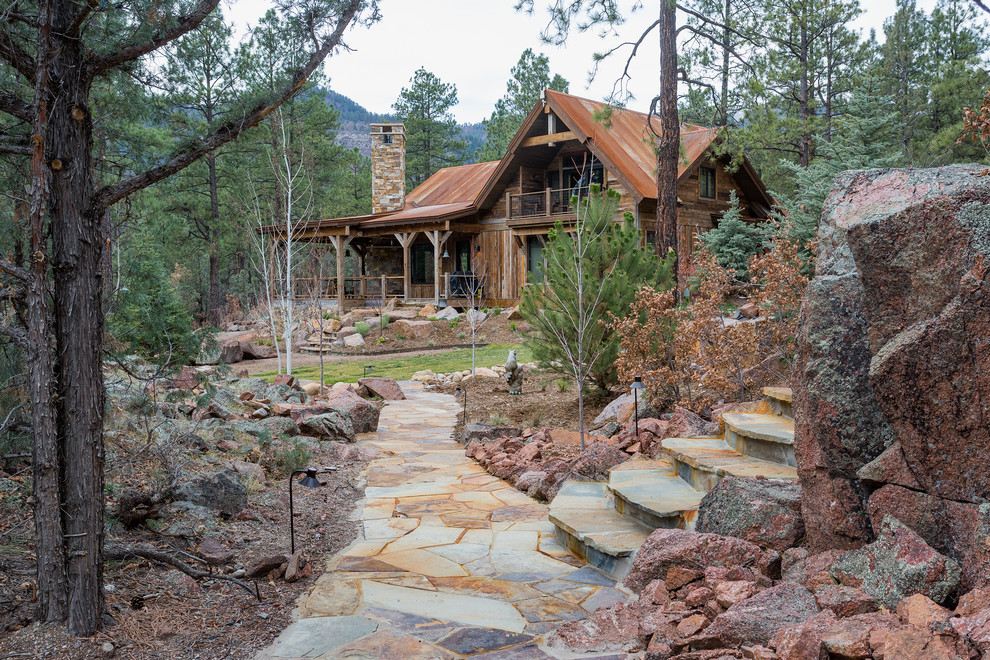 Example of a mountain style home design design in Albuquerque