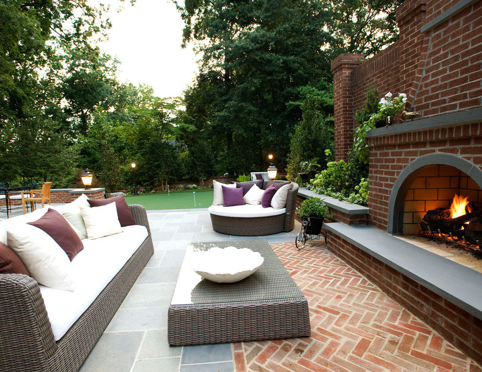 This is an example of a traditional patio in DC Metro with a fire feature, brick pavers and no cover.