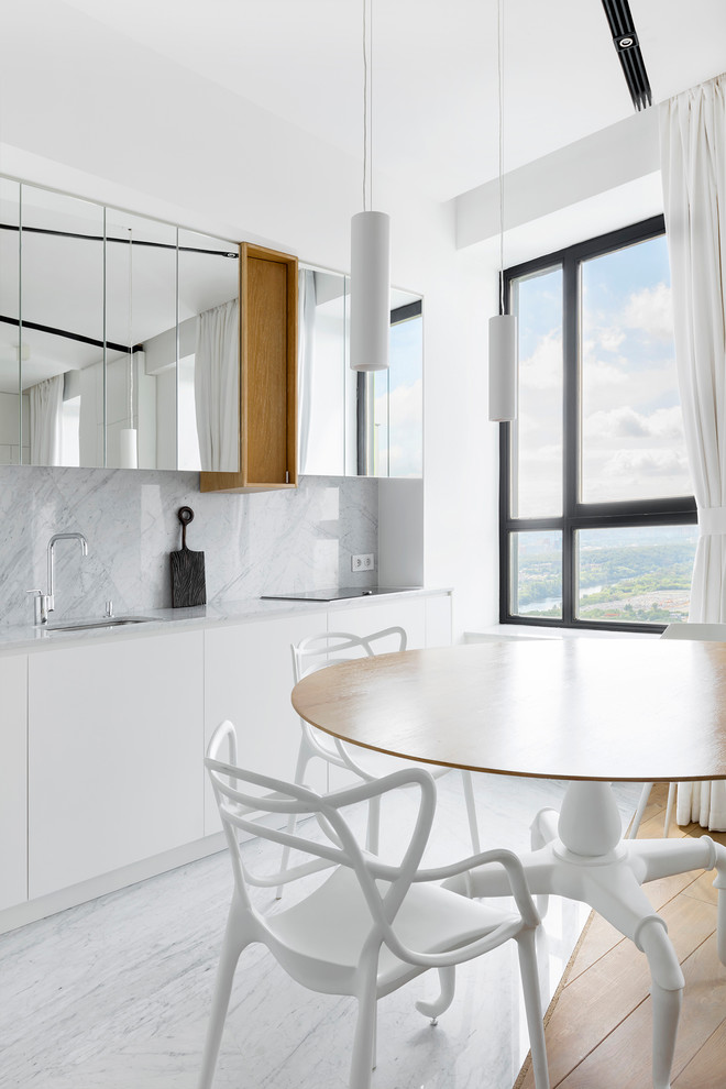 Contemporary eat-in kitchen in Moscow with an undermount sink, white cabinets, no island, flat-panel cabinets, marble benchtops, grey splashback, marble splashback, marble floors, grey floor and grey benchtop.