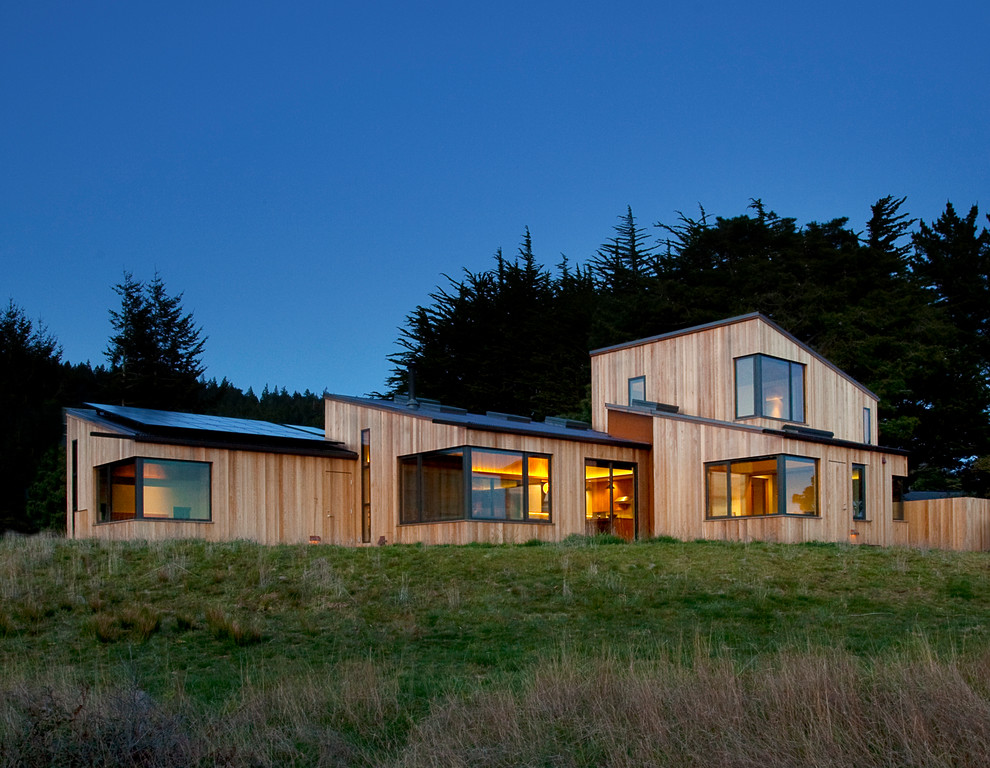 Photo of a contemporary exterior in San Francisco with wood siding and a shed roof.