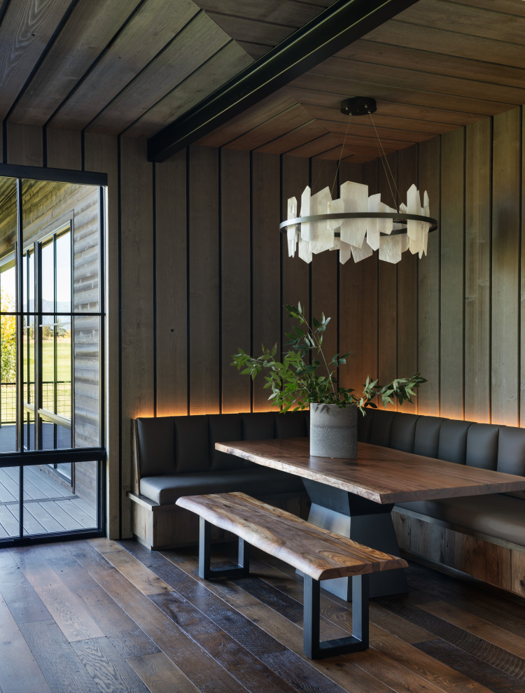 Example of a mountain style dining room design in Other
